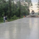 A concrete test road being laid