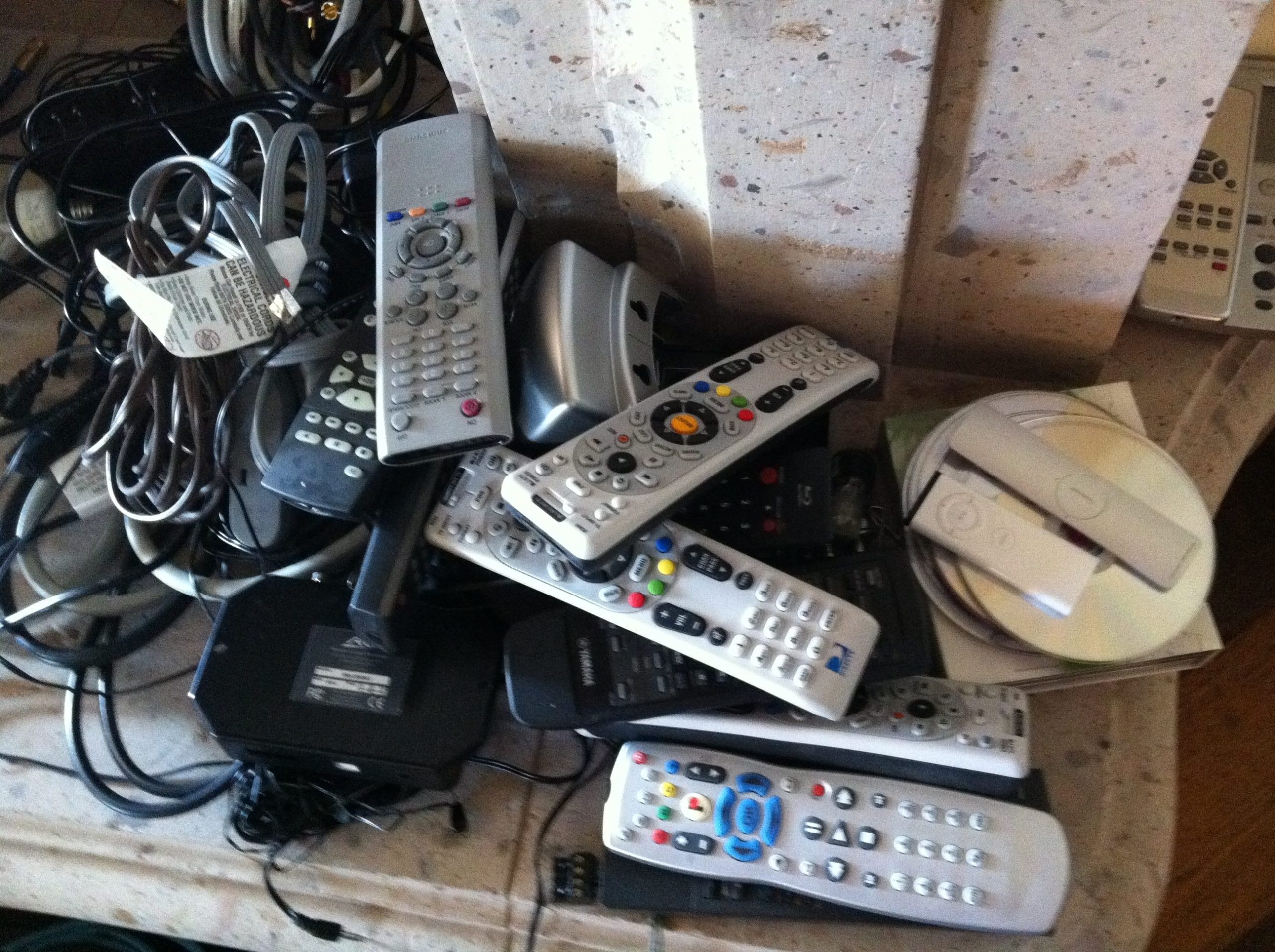 A pile of mostly remotes