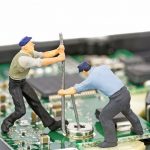 Tiny workers on a motherboard
