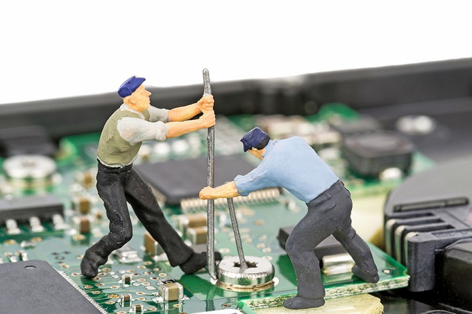 Tiny workers on a motherboard