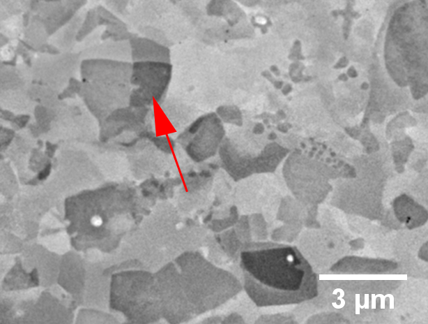 Micrograph showing lobed nucleation of recrystallization off a hard particle in a Ni superalloy.