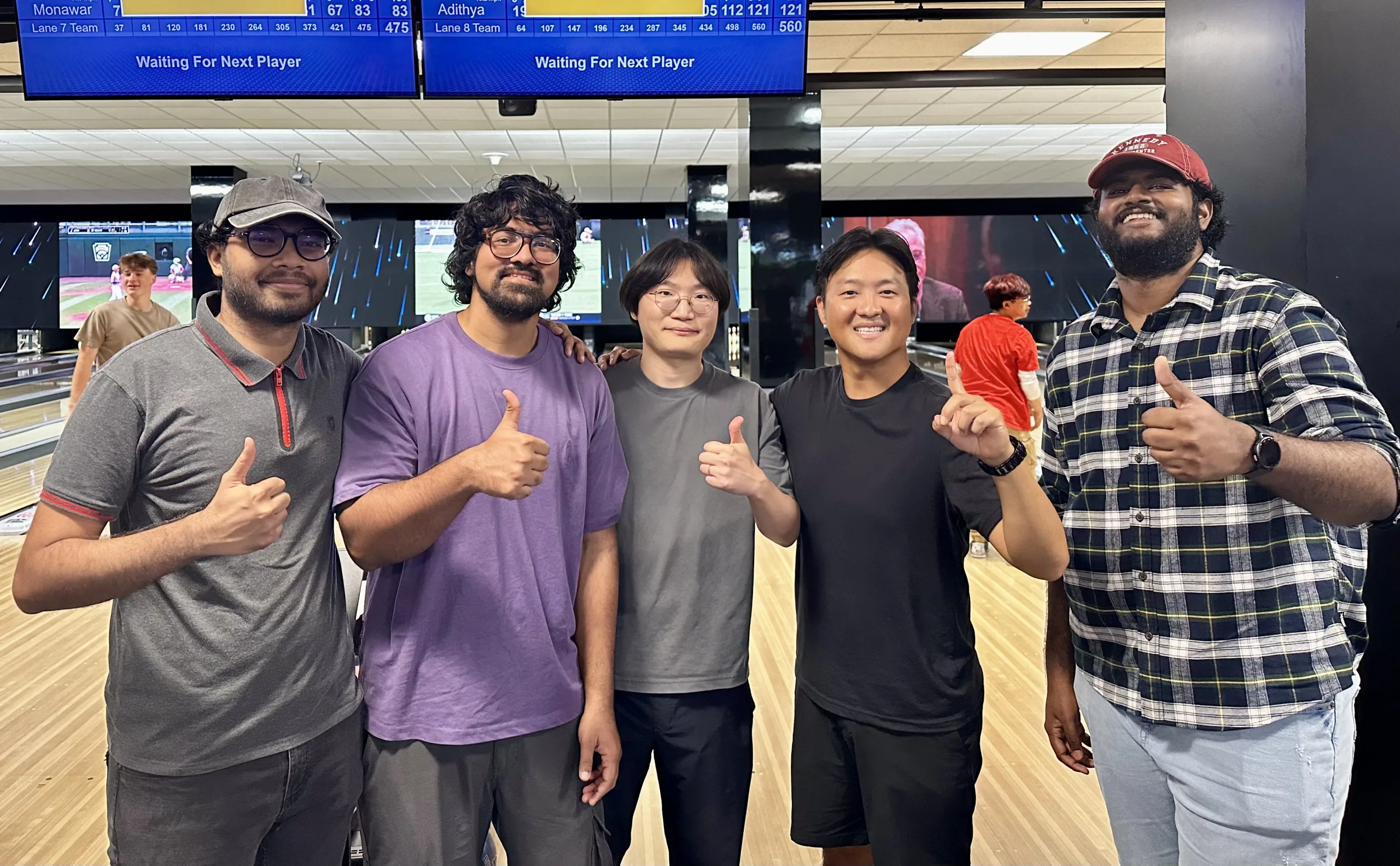 PERL group members posing at a bowling alley